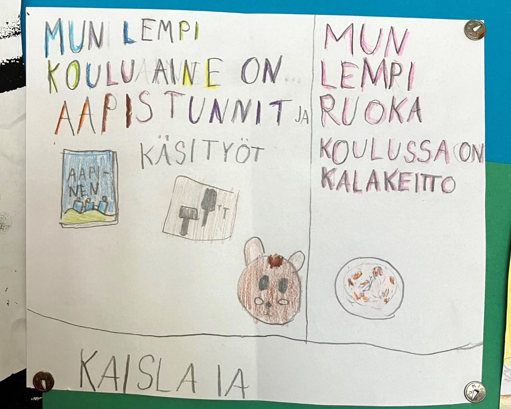 Oppilaan tekemä pieni juliste, jossa hän kertoo lempikouluaineistaan ja lempikouluruoastaan.